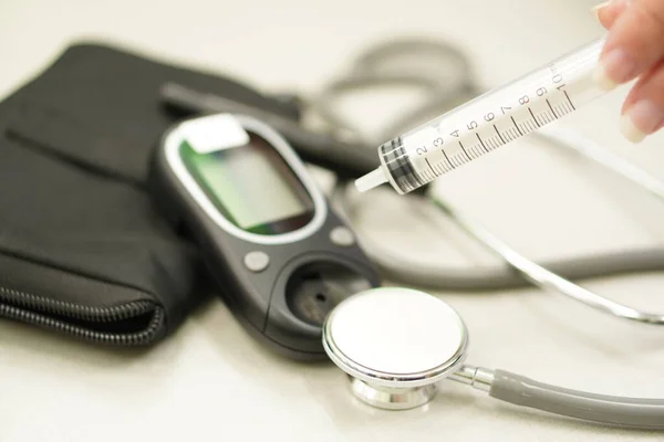 Medical: Stethoscope and blood sugar monitor, diabetes monitor.