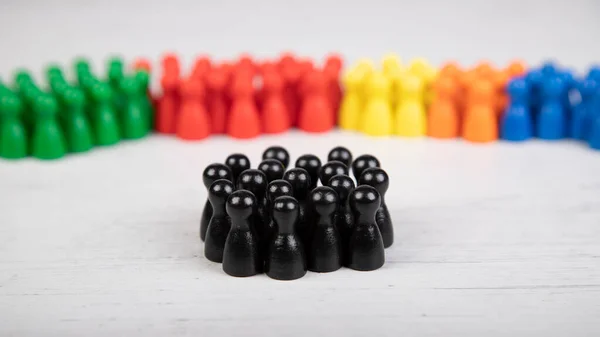 wooden figurines in the colors of German political parties, in front members of Christian Democratic Union