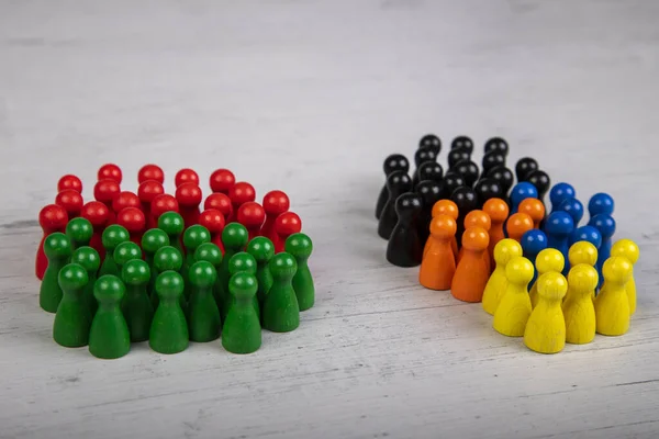 wooden figurines in the colors of German political parties, Green Party and SPD as government coalition and other parties as opposition