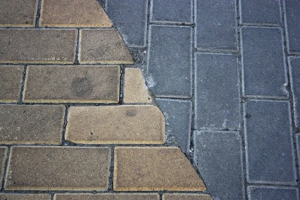 Two Types Antagonists Tiles Grey Yellow Dirty Street Pavement — Zdjęcie stockowe