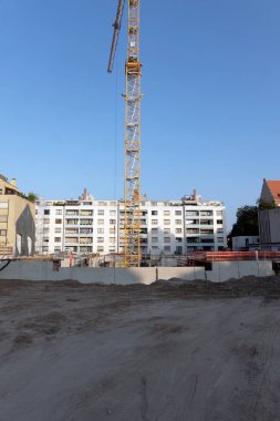 Housing: construction site with crane