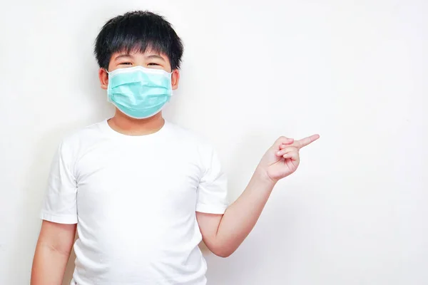 Asian Boy Medical Surgical Mask Wearing White Shirt Pointing His — Stockfoto