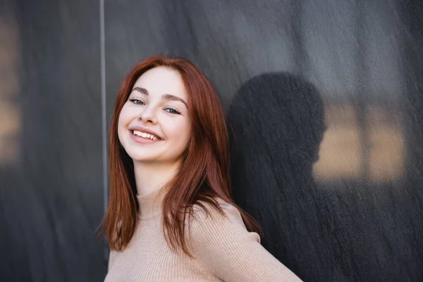Happy Redhead Woman Beige Turtleneck Smiling Grey Marble Wall — 스톡 사진