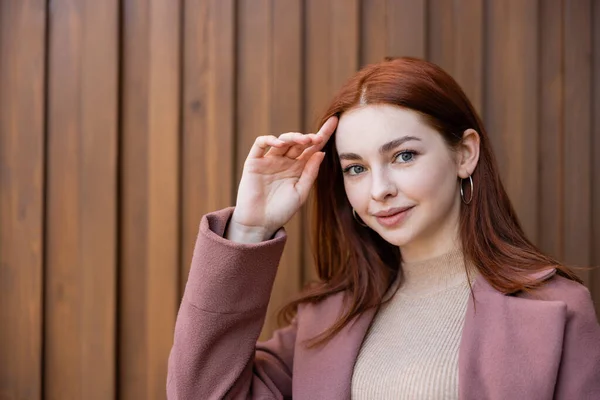 Portrait Pretty Young Woman Adjusting Red Hair — Foto de Stock