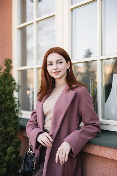 Redhead Young Woman Coat Standing Windows — стоковое фото