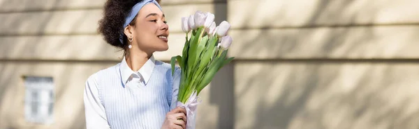 Joyful African American Woman Looking Bouquet Tulips Street Banner — Stock Photo, Image