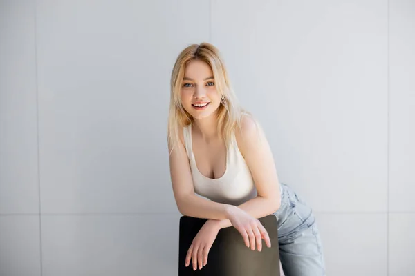 Happy Young Woman Looking Camera Chair Home — Stock Photo, Image