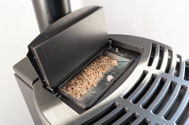 Close up of the top of a black pellet stove
