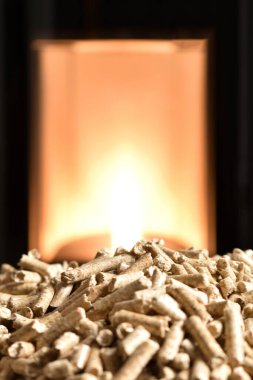 Modern domestic pellet stove, granules stove with flames