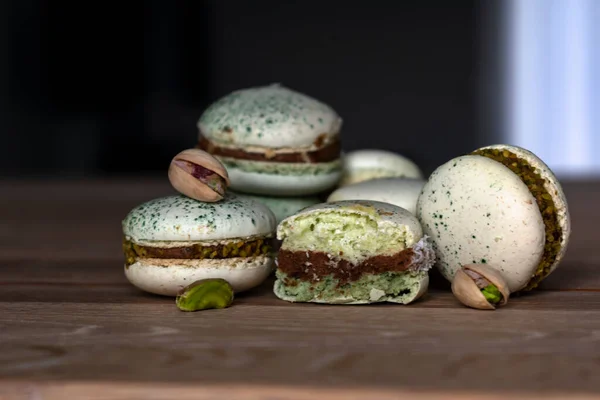 Homemade Pistachio Chocolate Macaroons Stacked Wooden Table Pistachio Nuts — Stock Photo, Image