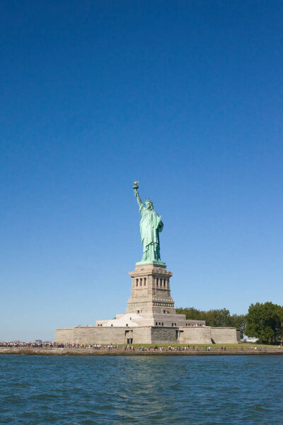 NEW YORK - CIRCA SEPTEMBER, 2017: Miss Liberty enjoys some sunbathing on Liberty Island