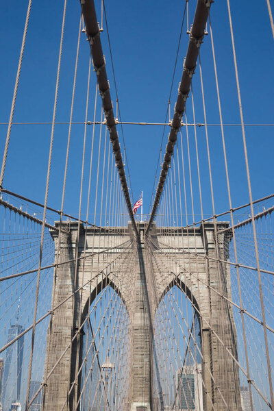 NEW YORK - CIRCA SEPTEMBER, 2017: American flag flutters on Brooklyn Bridge