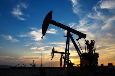The oil pump is working under the clouds