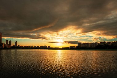 The evening was clouded over the city