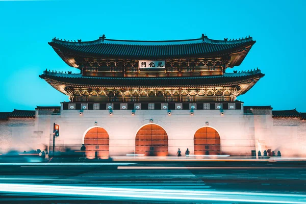 Traditional Korean Gwanghwamun Door Palace at Night with Beautiful Long Exposure Traffic