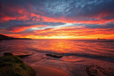 Amazing red sunrise over the sea.	