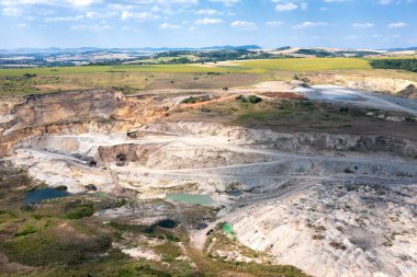 Aerial drone view flight over a quarry. Mining industry.	