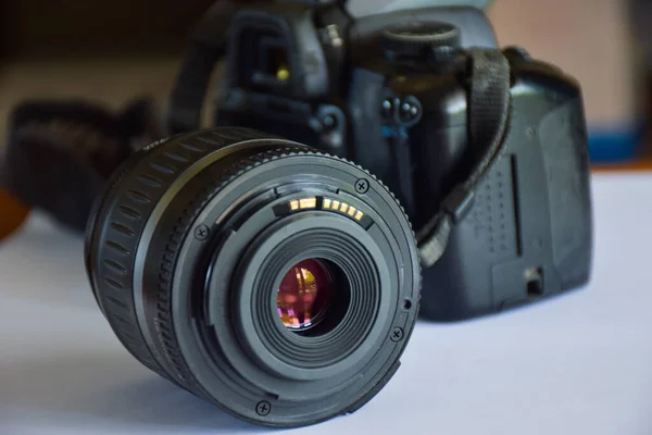 camera and len white background and light blu