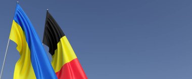 Bayrak direğinde Belçika ve Ukrayna bayrakları. Mavi arka planda bayraklar. Mesaj için yer. Bağımsız Ukrayna. Belçika bayrağı. Brüksel. Bağımsız Devletler. 3B illüstrasyon.