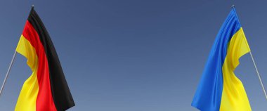 Bayrak direğinde Ukrayna ve Almanya bayrağı. Mavi arka planda bayraklar. Mesaj için yer. Bağımsız Ukrayna. Almanya 'nın devlet sembolleri. Alman bayrağı. 3B illüstrasyon.