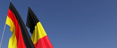 Bayrak direğinde Almanya ve Belçika bayrakları var. Mavi arka planda bayraklar. Mesaj için yer. Berlin, Münih. Brüksel, Avrupa. Bağımsız Devletler. 3B illüstrasyon.