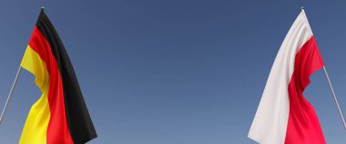 Bayrak direğinde Polonya ve Almanya bayrakları var. Mavi arka planda bayraklar. Mesaj için yer. Polonya, Varşova. Berlin, Münih. Bağımsız Devletler. 3B illüstrasyon.