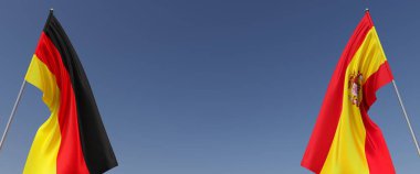 Mavi arka planda bayrak direkleri üzerinde Almanya ve İspanya bayrakları. Mesaj için yer. Rüzgarda dalgalanan bayraklar. Alman, Berlin. İspanyol, Madrid. 3d illüstrasyon.