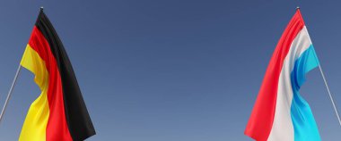 Mavi arka planda bayrak direkleri üzerinde Almanya ve Lüksemburg bayrakları. Mesaj için yer. Rüzgarda dalgalanan bayraklar. Alman, Berlin. Prenslik. 3d illüstrasyon.