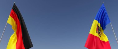 Mavi arka planda bayrak direkleri üzerinde Almanya ve Moldova bayrakları. Mesaj için yer. Rüzgarda dalgalanan bayraklar. Alman, Berlin. Chisinau. 3d illüstrasyon.