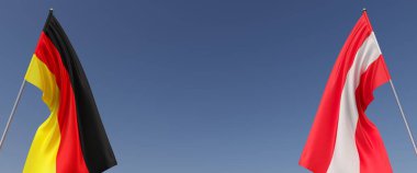 Mavi arka planda bayrak direkleri üzerinde Almanya ve Avusturya bayrakları. Mesaj için yer. Rüzgarda dalgalanan bayraklar. Alman, Berlin. Viyana. 3d illüstrasyon.