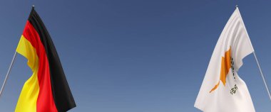 Mavi arka planda bayrak direkleri üzerinde Almanya ve Kıbrıs bayrakları. Mesaj için yer. Rüzgarda dalgalanan bayraklar. Alman, Berlin. Avrupa. 3d illüstrasyon.