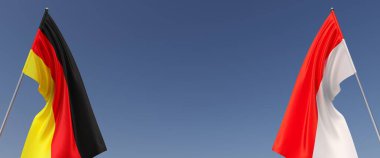 Mavi arka planda bayrak direkleri üzerinde Almanya ve Endonezya bayrakları. Mesaj için yer. Rüzgarda dalgalanan bayraklar. Alman, Berlin. Jakarta. 3d illüstrasyon.