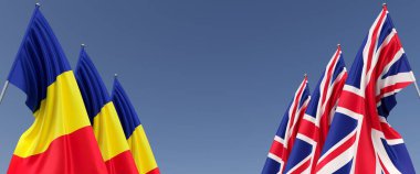 Büyük Britanya ve Romanya bayrakları bayrak direğine asıldı. Mavi arka planda bayraklar. İngiltere, Birleşik Krallık. Bükreş. 3B illüstrasyon.