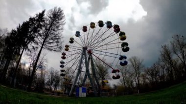 Cloud timelapse. Ferris wheel against the background of rapidly moving clouds. Timelapse of an approaching thunderstorm in northern Europe. Rapid movement of clouds. Fast filming. Interval filming.