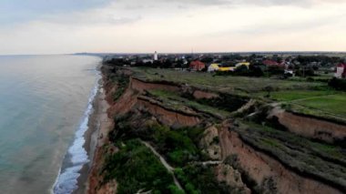 Aerial view of Sanzheyka village, Odessa region. Shot from a drone resort on the Black Sea, the village of Sanzheyka. Place of wild rest in Odessa. Clay cliff on the Black Sea coast in Odessa.