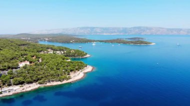 Drone shot on boat trips to the nearby Paklinsky Islands. Secluded beaches and coves in Croatian island of Hvar. Dubovitsa, and lavender fields frame from drone. Drone shot on Croatian island