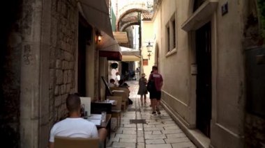 Croatian city of Split in the resort region of Dalmatia. A colorful street in the city of Split. Palace of Diocletian. Palace in Split built by the Roman Emperor Diocletian