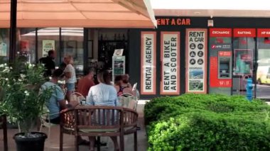 People sit in a restaurant on the waterfront in Split. People eat and drink drinks in a cafe in the city of Split. Cafes and restaurants along the boulevard in Split Croatia.