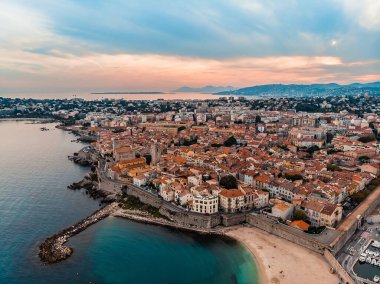 Drone shot of the old city of Antibes. Cote d'Azur of the Mediterranean Sea of France. Resort on the French Riviera Antibes. Picasso Museum. View from the drone yachts moored in the city marina.