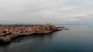Drone shot of the old city of Antibes. Cote d'Azur of the Mediterranean Sea of France. Resort on the French Riviera Antibes. Picasso Museum. View from the drone yachts moored in the city marina.