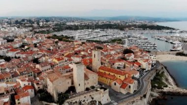Drone shot of the old city of Antibes. Cote d'Azur of the Mediterranean Sea of France. Resort on the French Riviera Antibes. Picasso Museum. View from the drone yachts moored in the city marina.