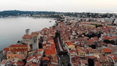 Drone shot of the old city of Antibes. Cote d'Azur of the Mediterranean Sea of France. Resort on the French Riviera Antibes. Picasso Museum. View from the drone yachts moored in the city marina.