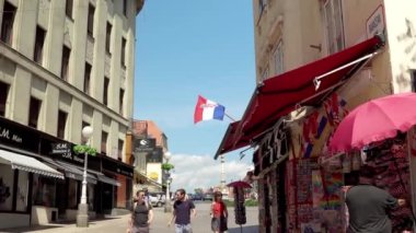 Central street with cafes and restaurants in Zagreb. Colorful streets with people in Zagreb. Souvenir shops in Croatia. Ban Josip Jelacic Square in Zagreb