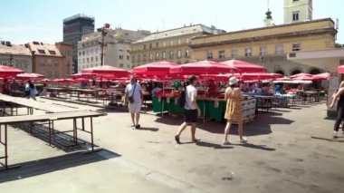 Dolac market in Zagreb. Zagreb Central Market. Farmer's market in the center of Zagreb. Wood products and vines, flowers and a variety of souvenirs. Red umbrellas Dolac.