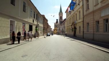 Central street with cafes and restaurants in Zagreb. Colorful streets with people in Zagreb. Souvenir shops in Croatia. Ban Josip Jelacic Square in Zagreb