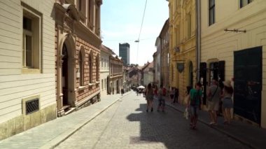 Central street with cafes and restaurants in Zagreb. Colorful streets with people in Zagreb. Souvenir shops in Croatia. Ban Josip Jelacic Square in Zagreb