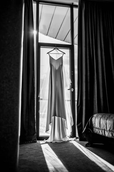 wedding dress in the hotel on the background of the window