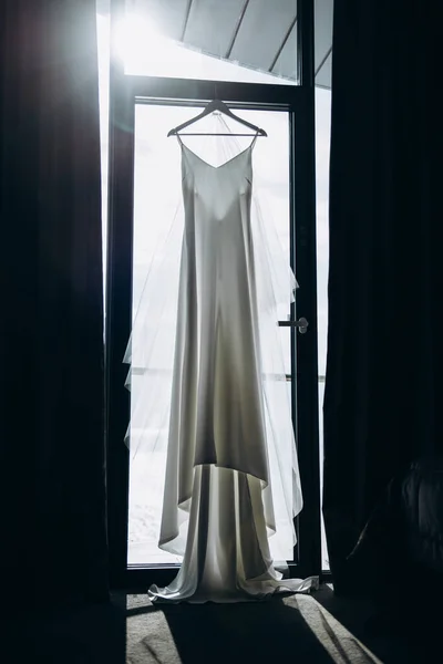 wedding dress in the hotel on the background of the window