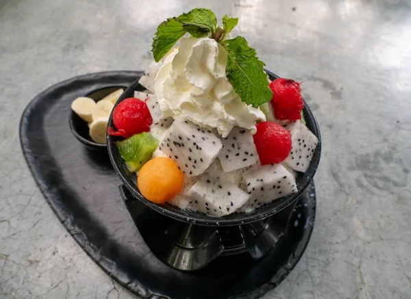 Bingsu dessert with colorful fruit flavors and topping