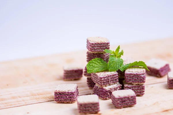 Mint and Candy wafer placed on a wooden table